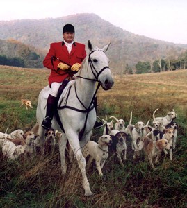Photograph of David on horse with hounds at 2003 Opening hunt. Photograph by Nathan Beck